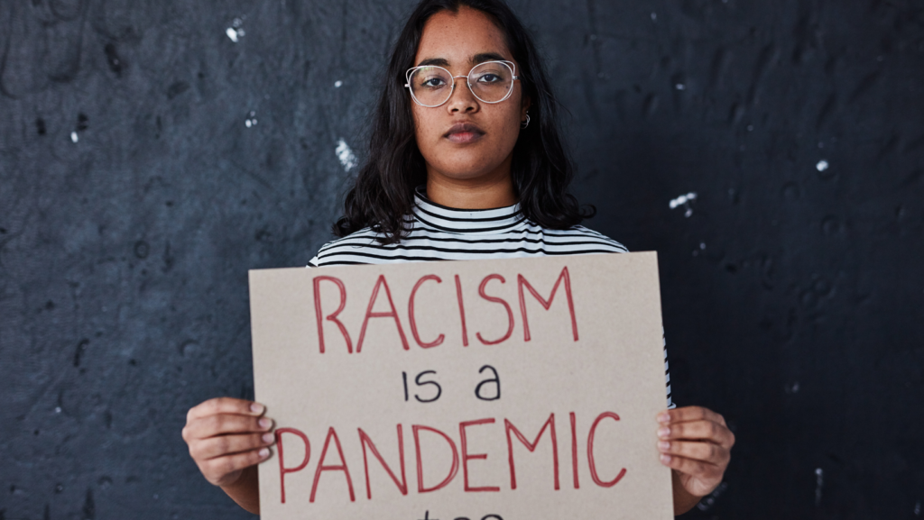 woman holding a sign