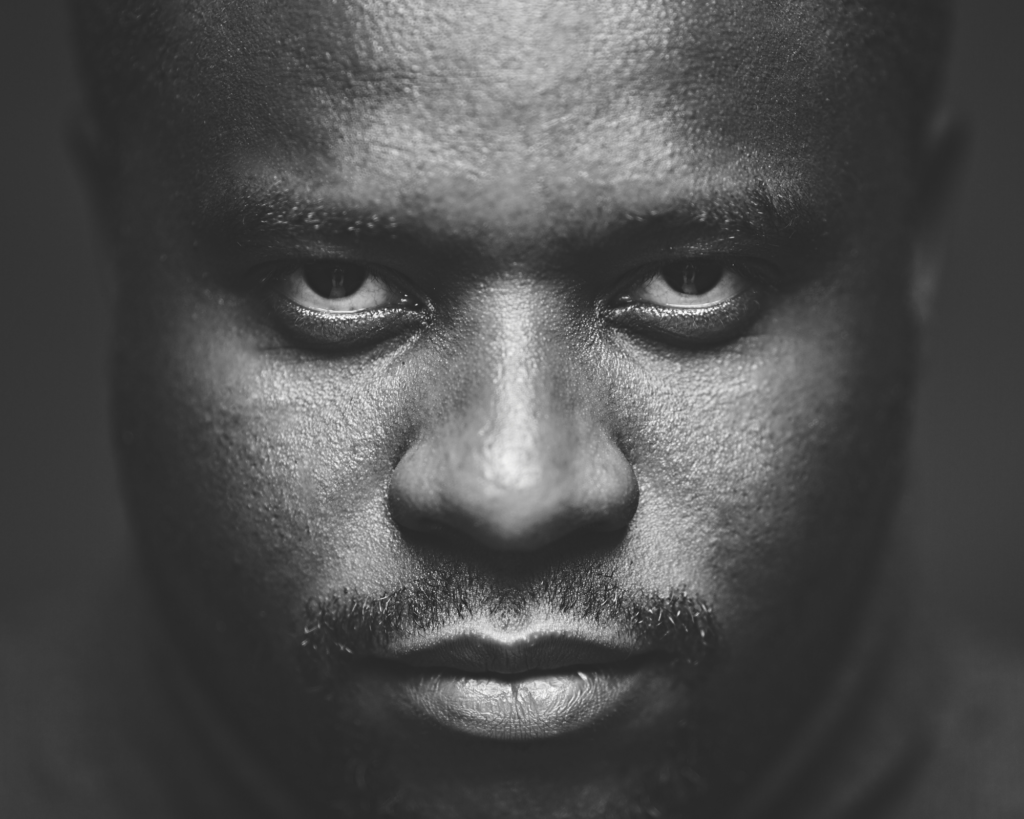 Man looking directly at camera unsmiling