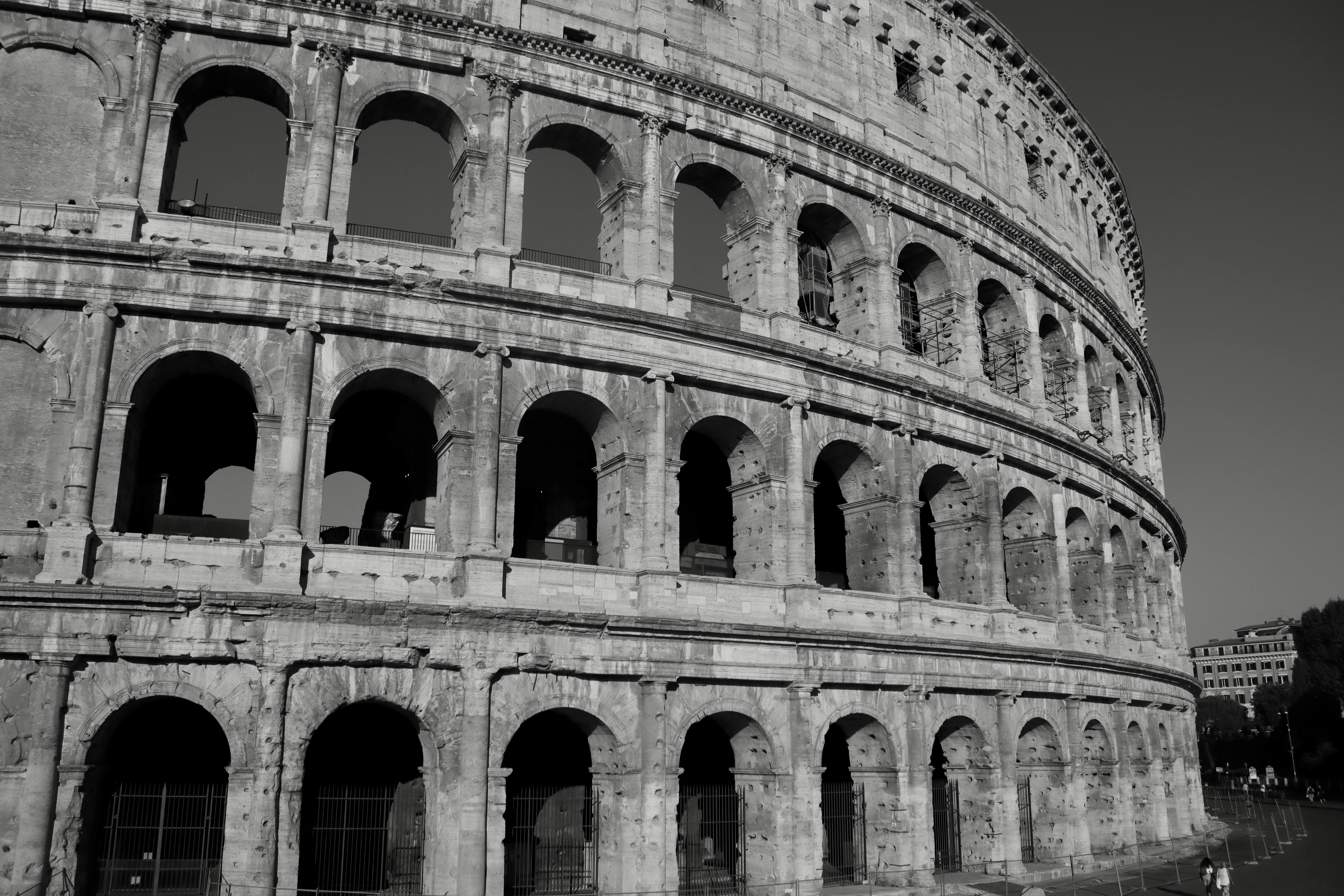 A stunning monochrome view of the historic Colosseum in Rome, Italy, capturing its architectural grandeur.
